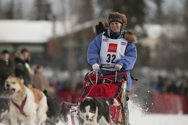 Dog Musher Debbie Moderow leaves the shoot for the 1000 mile 2003 Iditarod sled dog race from Fairbanks to Nome, Alaska . Lack of snow along the normal trail route further south forced the relocation of the restart on the Chena River in Fairbanks.